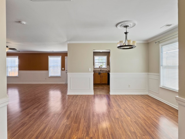 spare room with ceiling fan, dark hardwood / wood-style floors, and ornamental molding