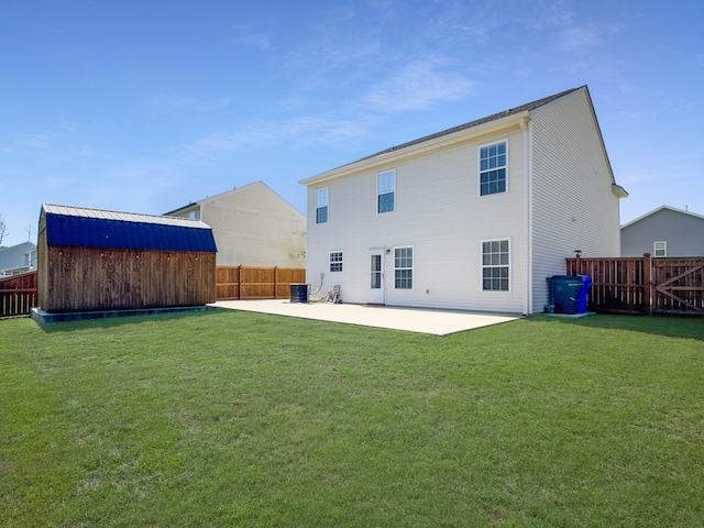 back of property featuring a lawn, a patio, and central AC unit