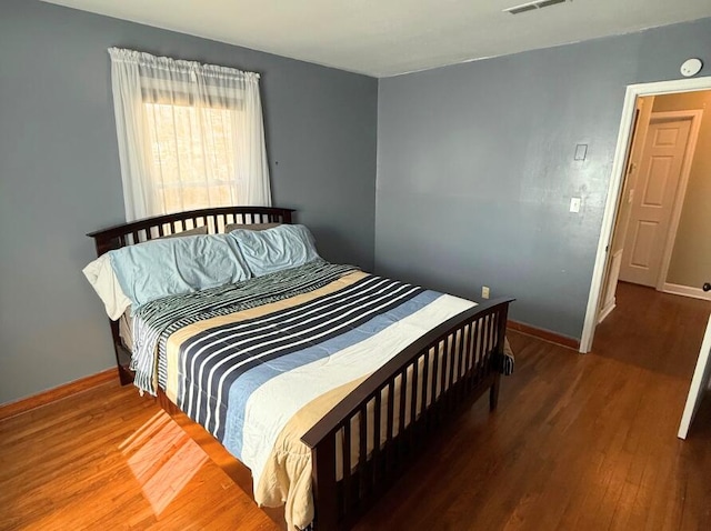 bedroom featuring hardwood / wood-style flooring