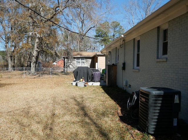 view of yard with central AC unit