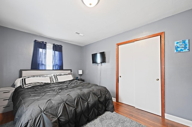 bedroom with hardwood / wood-style floors