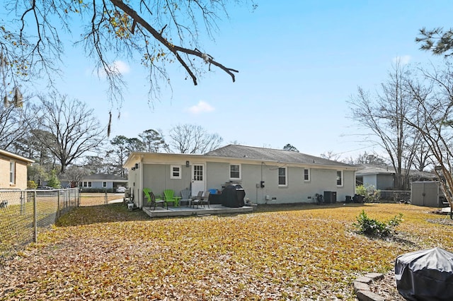 rear view of house featuring central AC unit