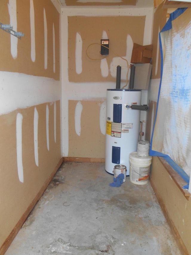 utility room featuring water heater