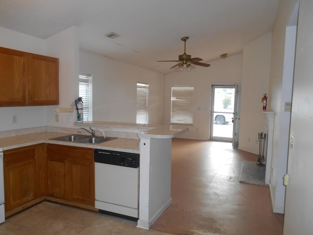 kitchen with vaulted ceiling, kitchen peninsula, sink, ceiling fan, and white dishwasher