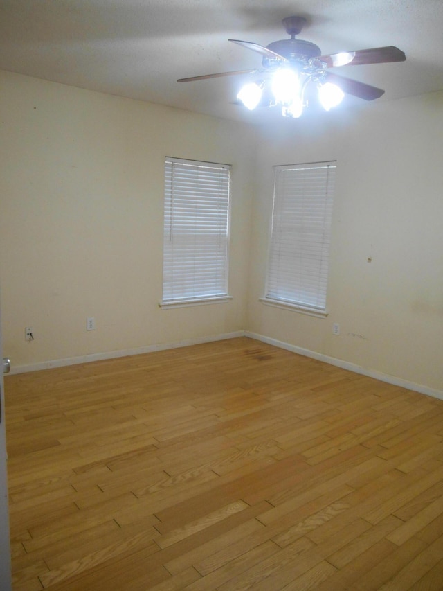 empty room featuring light hardwood / wood-style floors and ceiling fan