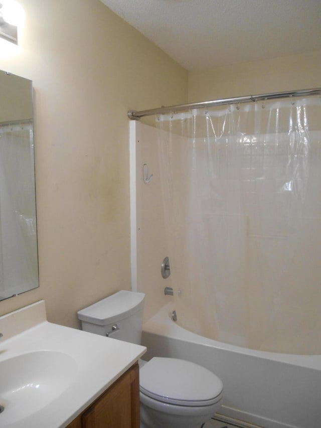 full bathroom featuring toilet, vanity, and shower / bath combo with shower curtain