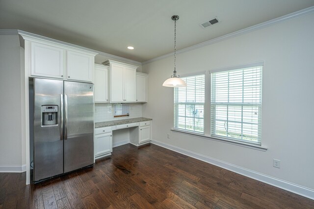 9710 Table Mountain Ln, Ladson, SC 29456 - kitchen featuring stainless steel fridge with ice dispenser, built in desk, tasteful backsplash, white cabinets, and ornamental molding