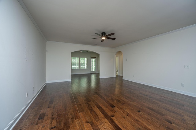 9710 Table Mountain Ln, Ladson, SC 29456 - spare room featuring arched walkways, ornamental molding, a ceiling fan, and dark wood-type flooring