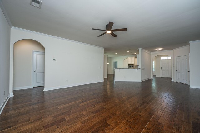 9710 Table Mountain Ln, Ladson, SC 29456 - unfurnished living room featuring arched walkways, a ceiling fan, crown molding, dark wood-type flooring, and recessed lighting