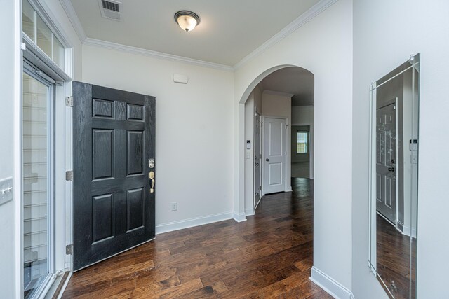 9710 Table Mountain Ln, Ladson, SC 29456 - foyer featuring arched walkways, ornamental molding, and dark wood-style floors
