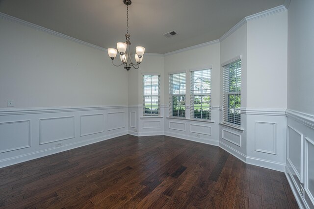 9710 Table Mountain Ln, Ladson, SC 29456 - unfurnished dining area with dark wood-type flooring, a chandelier, crown molding, wainscoting, and a decorative wall