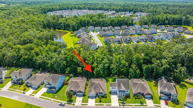9710 Table Mountain Ln, Ladson, SC 29456 - aerial perspective of suburban area featuring a heavily wooded area and a nearby body of water