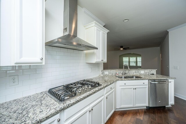 9710 Table Mountain Ln, Ladson, SC 29456 - kitchen with wall chimney range hood, stainless steel appliances, a ceiling fan, a peninsula, and dark wood-style floors
