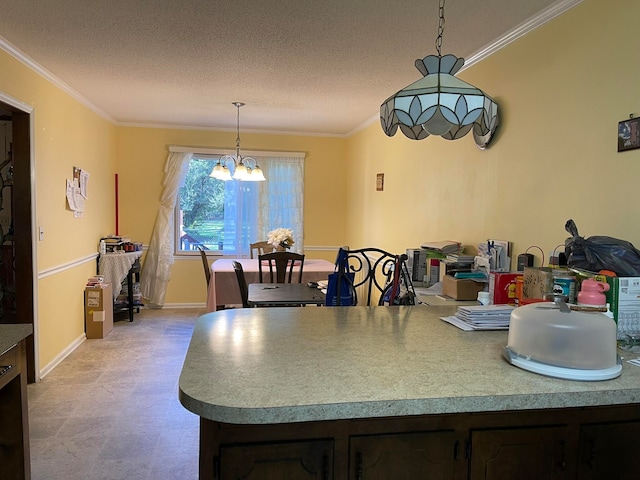 kitchen featuring ornamental molding, dark brown cabinets, a notable chandelier, and a textured ceiling