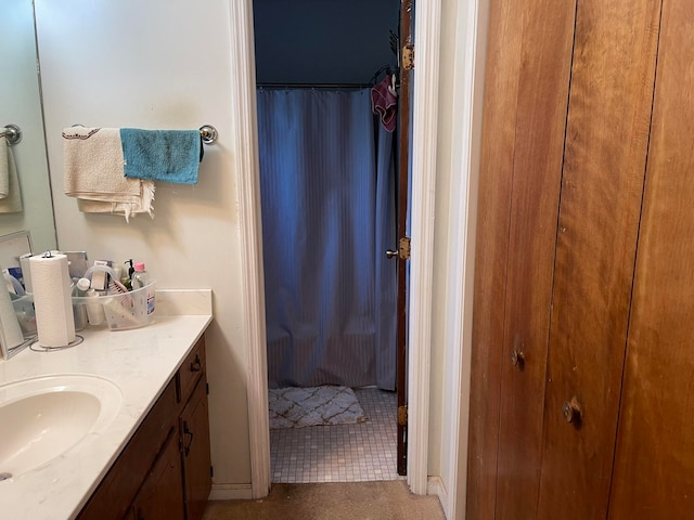 bathroom featuring tile patterned flooring, vanity, and a shower with curtain