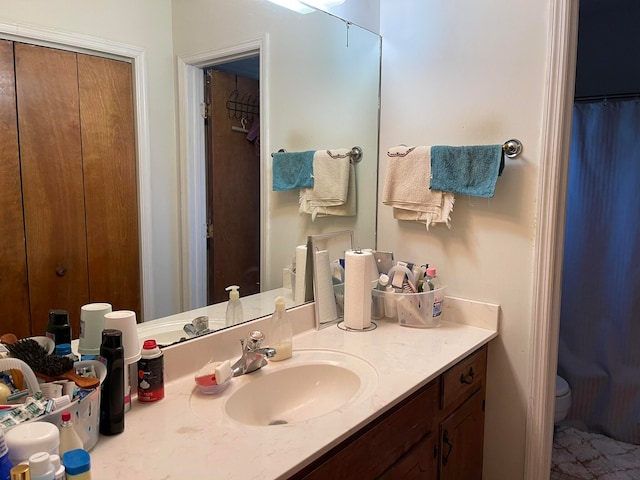 bathroom with vanity and toilet