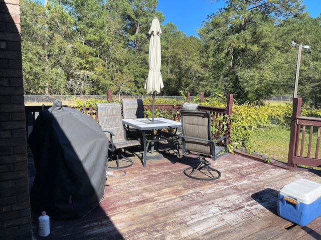 wooden deck with grilling area