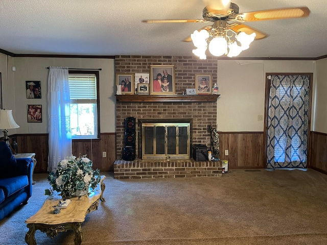 living room with a brick fireplace, wood walls, and a textured ceiling