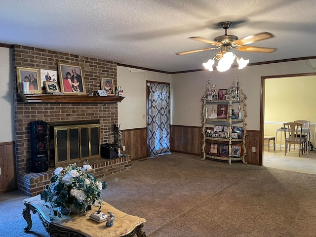 living room with ceiling fan, a textured ceiling, wooden walls, and carpet