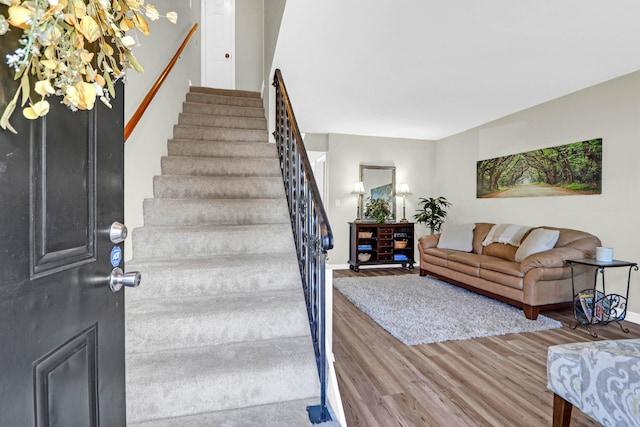 stairs with hardwood / wood-style flooring