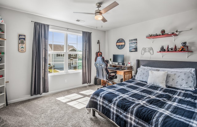 bedroom featuring visible vents, baseboards, ceiling fan, and carpet flooring