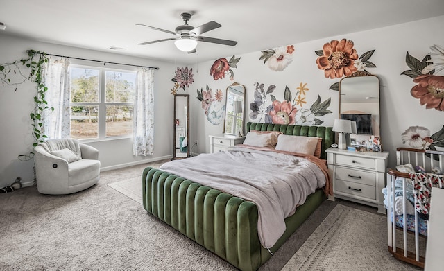 bedroom with baseboards, a ceiling fan, and carpet flooring