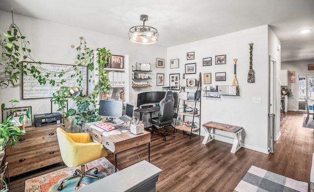 office area featuring baseboards and wood finished floors