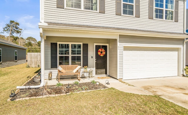 view of front of house featuring driveway, a front lawn, a porch, fence, and a garage