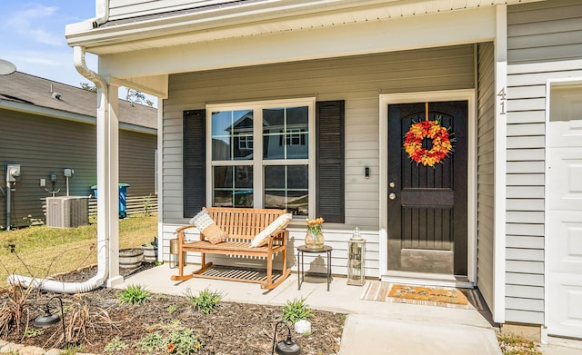 entrance to property with central air condition unit and covered porch