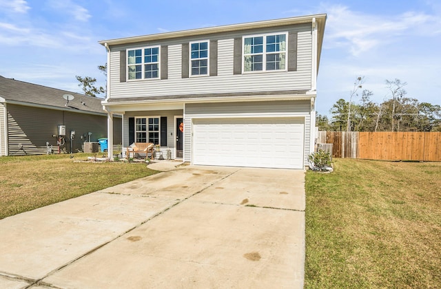 traditional-style home featuring driveway, an attached garage, a front yard, and fence