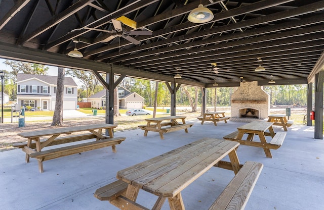 view of patio / terrace featuring an outdoor stone fireplace