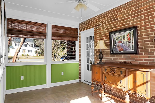 sunroom / solarium with ceiling fan