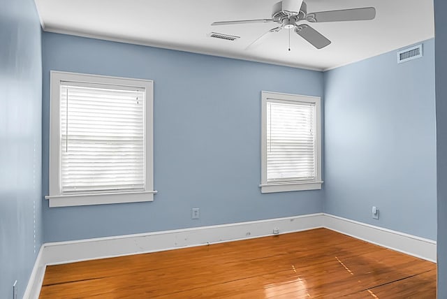 spare room featuring ceiling fan and hardwood / wood-style flooring