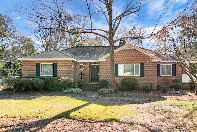 ranch-style house featuring a front lawn