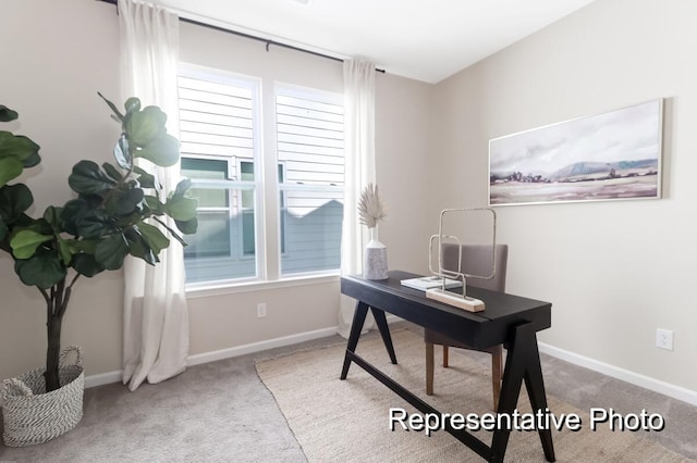 carpeted home office with baseboards