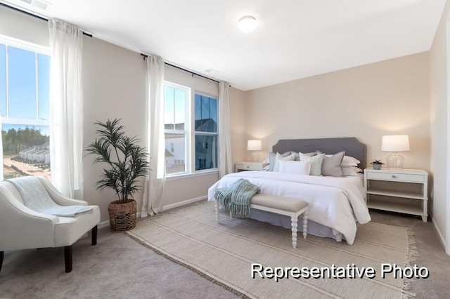 bedroom with carpet and baseboards