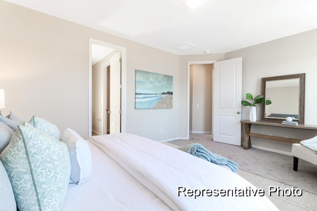 bedroom with carpet floors and baseboards