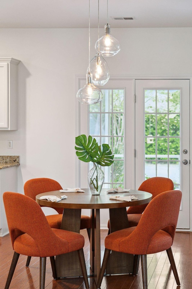 dining room with wood finished floors