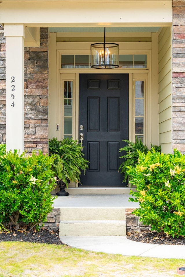 doorway to property with a porch