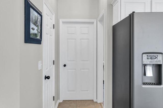 hallway with light tile patterned floors