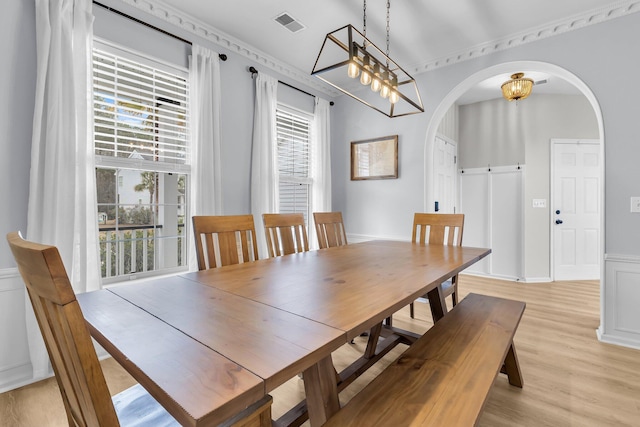 dining space with light hardwood / wood-style flooring