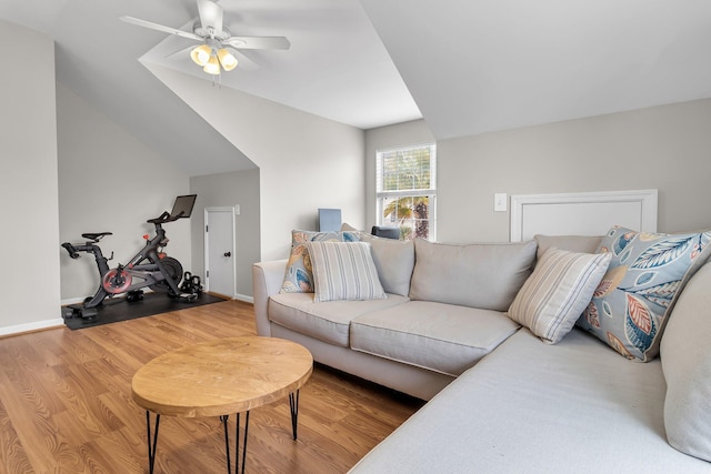 living room with hardwood / wood-style flooring, ceiling fan, and lofted ceiling