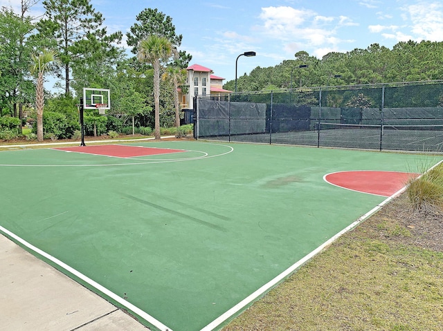 view of sport court featuring tennis court