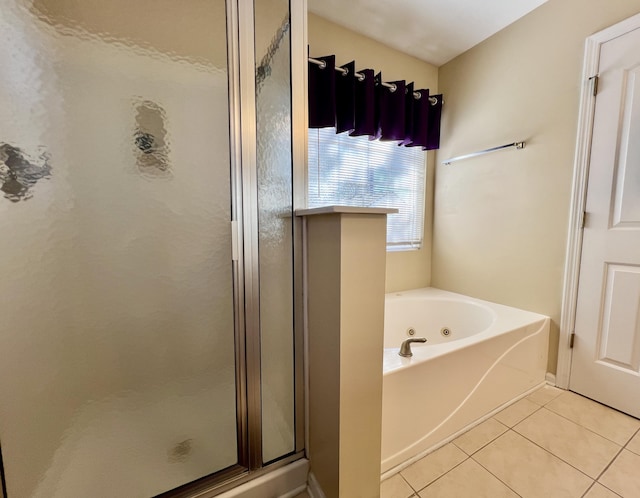 bathroom with tile patterned floors and plus walk in shower