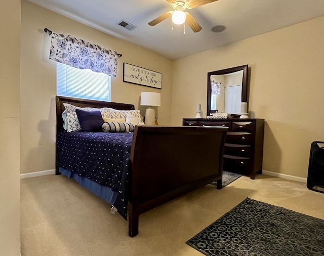 bedroom featuring ceiling fan and carpet