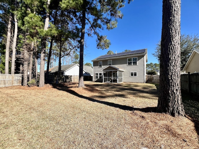 rear view of house with a sunroom