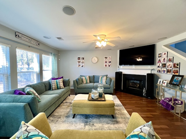 living room featuring ceiling fan and wood-type flooring