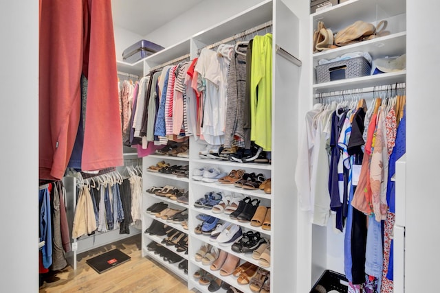 spacious closet featuring wood finished floors
