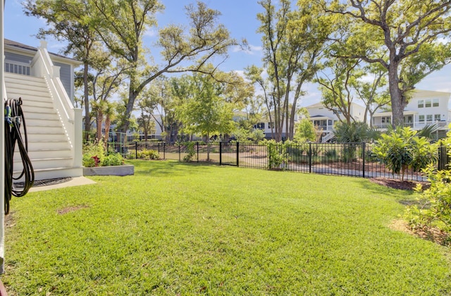 view of yard with a residential view and fence