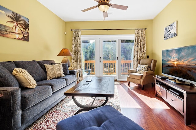 living room with hardwood / wood-style flooring and ceiling fan